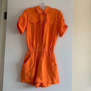 Orange romper from Just Unique. Size XS/S